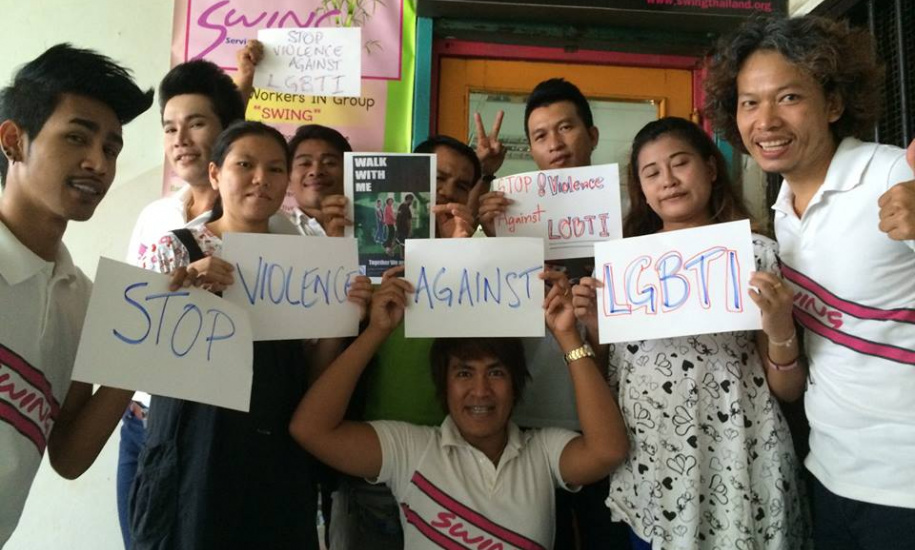 SWING staff promoting International Day against Homophobia and Transphobia at the entrance to the Patpong Bangkok  drop-in and office space