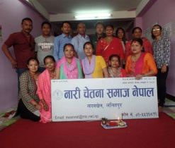 Members of SWAN Nepal with a banner